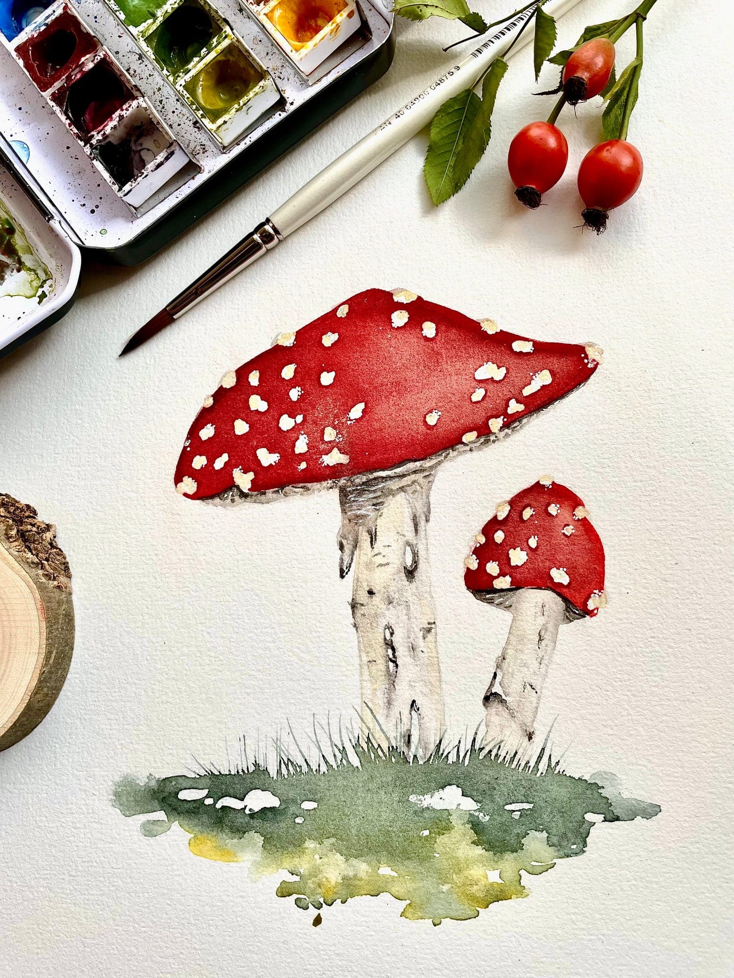 Aquarell zweier Fliegenpilze im Moos